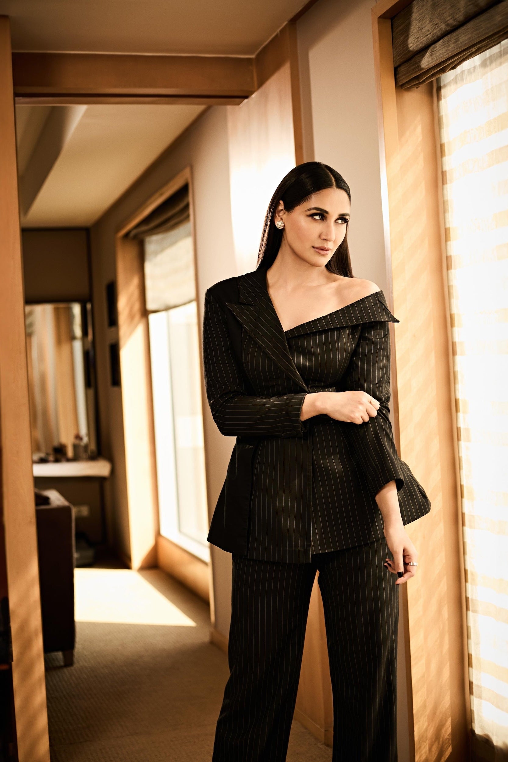 Nikita Dutta in Double Breasted Off Shoulder Suit Ensemble in Midnight Noir with pinstripes