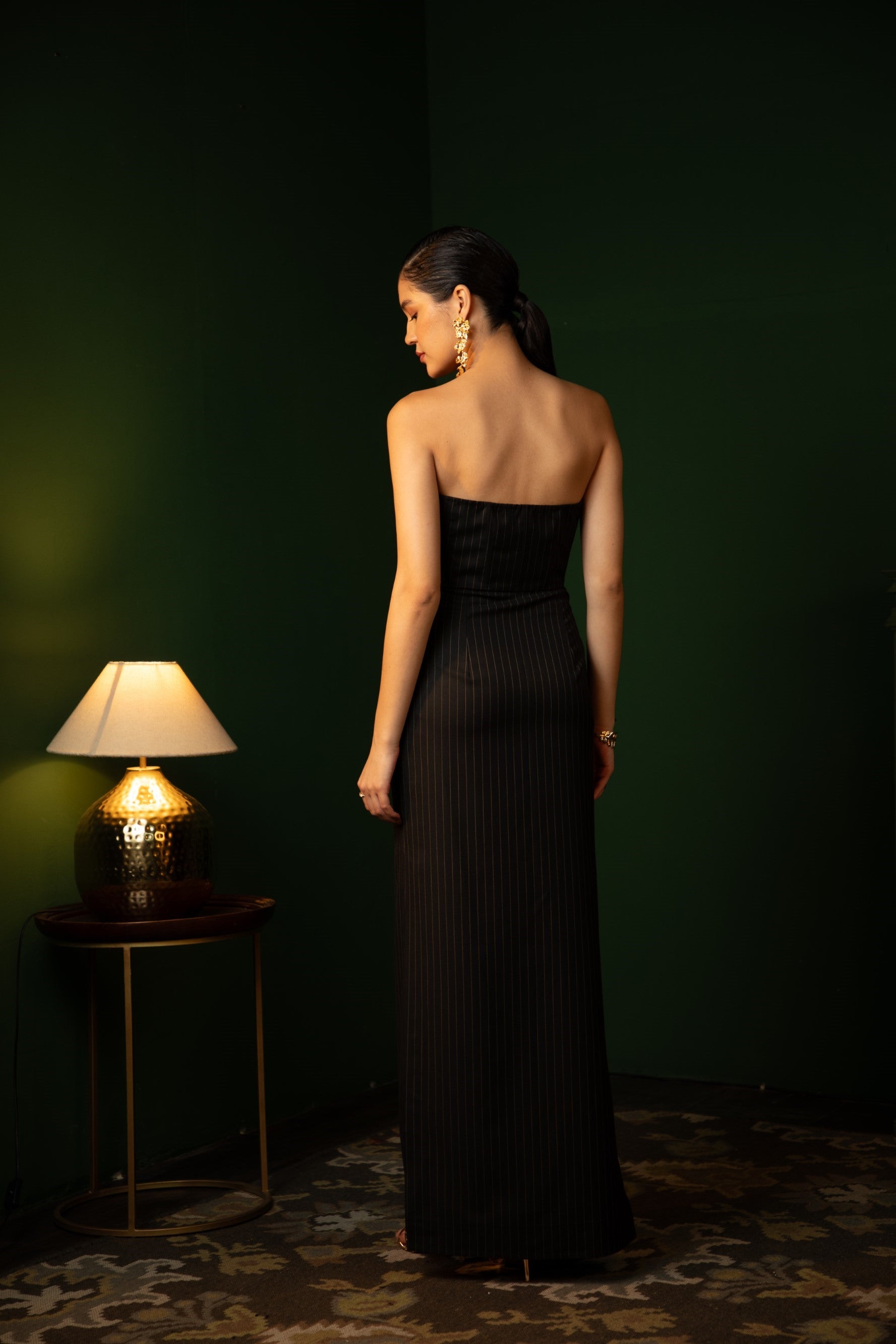 Helly Shah in Strapless Sweetheart Dress in Midnight Noir with pinstripes